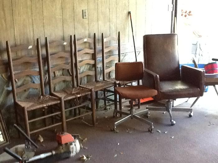 Four ladder back chairs and desk chairs