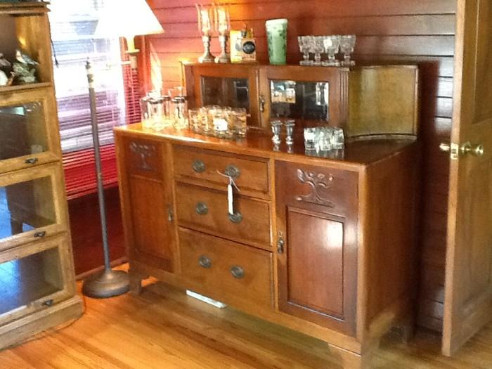 Wonderful bar/ credenza  with beveled glass  and mirrored back.