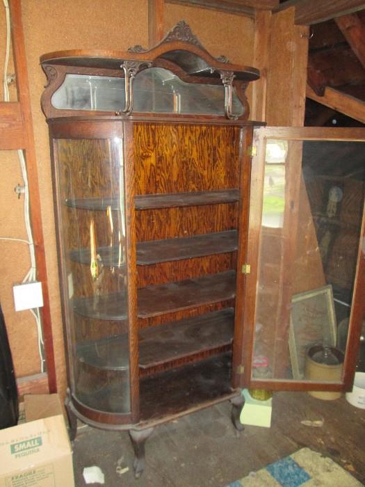 Available to be seen with an escort to the upstairs.  Beautiful hooded curved glass china cabinet.  Price is $600 firm - no discounts