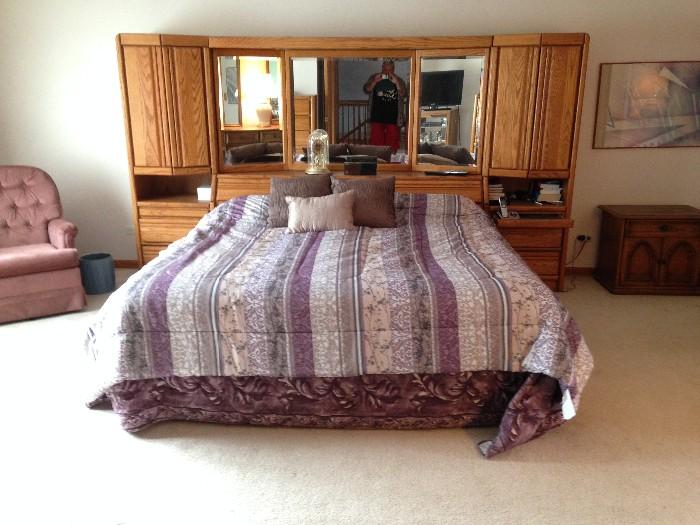 King size bed with light wood headboard and cabinets. includes new mattress(less than 1 year old) and all bedding box etc. 