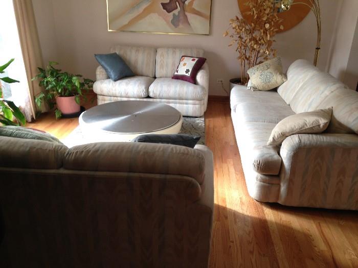 white and earth tone 1 couch 2 love seats all matching and coffee table 