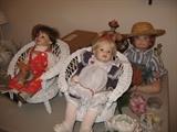 Porcelain dolls, many mint in box