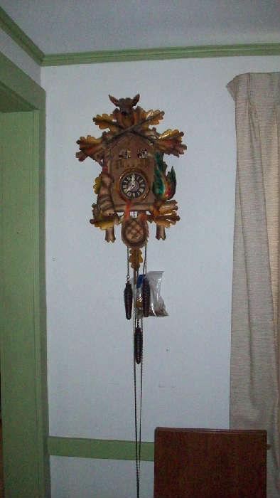 Antlers from deer are in baggie, unsure if cuckoo clock runs, acts like it wants to