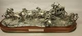 Lot 22  -  Pewter sculpture. "The holdup of the Overland Stage" by Gordon Phillips. Displaying 3 outlaws holding up a carriage. Number 238/750. Comes with custom wooden crate.-- Dimensions:  H: 8 inches: W: 26 inches: D: 8 1/2 inches --- 
