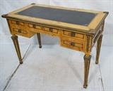 Lot 28  -  Decorative brass mounted writing desk. Burl wood with heavy brass mounts. Inset black leather top.-- Dimensions:  H: 31 1/4 inches: W: 46 inches: D: 24 1/2 inches --- 