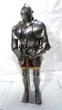 Lot 32  -  Reproduction suit of armor. Heavy steel suit of armor medieval style, very detailed with a long sword. Very heavy construction.-- Dimensions:  H: 67 inches: W: 30 inches: D: 16 inches --- 