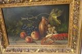 Lot 34  -  Still life oil painting of fruit and lobster on board. Signed lower right. Gilt wood frame. Frame is 5 1/4" wide,-- Dimensions:  Image Size: H: 14 inches: W: 22 inches --- 