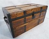 Lot 61  -  Antique wooden chest. Black metal straps. Leather handles. Refinished. Flat top. Fitted, upholstered interior. -- Dimensions:  H: 15 inches: W: 28 1/4 inches: D: 16 inches --- 