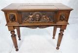 Lot 79  -  Oversized Carved Walnut Spinet Desk.  Lion and Indian Figural Carvings.  Interior drawer carved with bird.  Hidden compartment interior.  Fitted interior.-- Dimensions:  H: 40 inches: W: 47 inches: D: 22 inches --- 