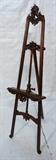Lot 85  -  Reproduction carved Easel.  Fancy carved wood with dark finish.-- Dimensions:  H: 76 inches: W: 24 inches: D: 32 inches --- 