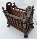 Lot 87  -  Reproduction Magazine Rack with Carved Ends and Paw Feet.  Open spindle sides.-- Dimensions:  H: 21 inches: W: 21 inches: D: 14 inches --- 