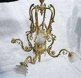 Lot 91  -  Fancy Brass Chandelier with Floral and Drape Design.  Glass flame center.-- Dimensions:  H: 30 inches: W: 31 inches --- 