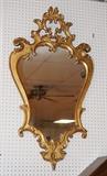 Lot 92  -  Pair Italian Gilt Wood Mirror.  Rococo Style.  Marked made in Italy.  -- Dimensions:  H: 45 inches: W: 26 inches --- 