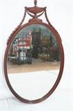 Lot 93  -  Vintage Mahogany Mirror.  Oval form with urn and drape top.-- Dimensions:  H: 44 inches: W: 26 inches --- 