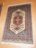 Lot 95  -  4'3" x 6'3" Oriental Area Carpet.  Signed on border.  Tan field.-- Dimensions:  H: 6'3" inches: W: 4'3" inches --- 