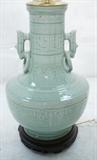 Lot 108  -  Celedon Green Pottery Lamp.  Asian Form with Ring Handles.  wood base.-- Dimensions:  H: 29 inches: W: 11 inches --- 