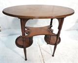 Lot 116  -  Victorian Occasional Display Table.  Oval top with 3 tier base. -- Dimensions:  H: 29 inches: W: 33 inches: D: 18 inches --- 