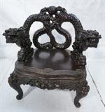Lot 118  -  Heavily Carved Chinese Arm Chair with Dragons.  Inlaid eyes.-- Dimensions:  H: 39 inches: W: 29 inches: D: 23 inches --- 