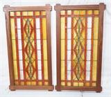 Lot 133  -  Pair Vintage Stained Glass Windows.  Custom Arts and crafts frame. Stain glass tightened and reframed.  Red and amber-- Dimensions:  H: 55.5 inches: W: 30 inches --- 