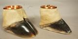 Lot 144  -  Pair Giraffe Hoof Ashtrays.  Copper lines. Taxidermy.-- Dimensions:  H: 5.5 inches: W: 5.5 inches: D: 8 inches --- 