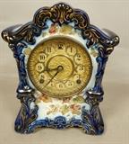 Lot 198  -  Antique Porcelain Case Mantle Clock.  Blue trim with floral decoration.-- Dimensions:  H: 11.5 inches: W: 8.5 inches: D: 5.5 inches --- 