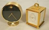 Lot 203  -  2pcs Brass Table Clocks.  Hamilton 4 sided with Quartz clock and meters.  Howard Miller Circle Clock.-- Dimensions:  H: 5.5 inches: W: 4.75 inches: D: 3 inches --- 