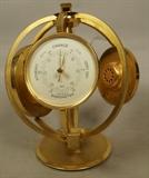 Lot 284  -  Imexal Armillary World Time Desk Clock with Thermometer and Barometer.  -- Dimensions:  H: 8 inches: W: 6.5 inches: D: 7.5 inches ---  <br><br>US Shipping charge:</b>  $20