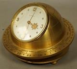 Lot 285  -  Guardier World Time Globe Desk Clock.  Movable outer dial.  Face flips for winding.  Heavy.-- Dimensions:  H: 4 inches: W: 6 inches ---  <br><br>US Shipping charge:</b>  $20