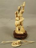 Lot 323  -  Japanese Carved Ivory Sculpture Figure. Fisherman with Basket of Crabs. Carved Ivory bamboo fishing rod. Mounted on wood base. Carved wood lower base. -- Dimensions:   ---  <br><br>US Shipping charge:</b>  $35