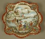 Lot 338  -  Japanese Porcelain Bowl. Wide Scalloped Edge. Paint decorated with Geisha Girls and Bridge. Marked. -- Dimensions:  H: 2.5 inches: W: 10.5 inches: D: 10.5 inches ---  <br><br>US Shipping charge:</b>  $35