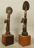 Lot 342  -  Pr Carved Wood African Figural Female Sculptures. Mounted on Square Wood Blocks. -- Dimensions:  H: 18.75 inches: W: 4 inches: D: 4.25 inches ---  <br><br>US Shipping charge:</b>  $35