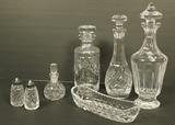 Lot 349  -  7pc WATERFORD Crystal Lot. Three Decanters with Stoppers. Pr S&P Shakers. Low Bowl. Perfume Bottle with Dauber. All marked.-- Dimensions:  H: 13 inches: W: 4.75 inches ---  <br><br>US Shipping charge:</b>  $35