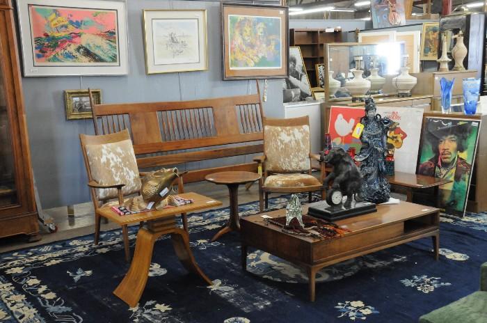 Paul Frankl lamp table, Sam Maloof headboard, hide armchairs, and lamp table, mid-century modern coffee table, Jimi Hendrix posters