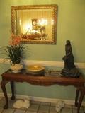 Console table with glass top and claw feet,  wall mirror, cats