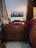 nightstand, clock, flowers