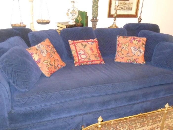Edith Allen sofa, pillows, art work, candleholders, weight balance