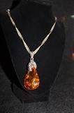 Large Amber Piece mounted on beautiful Sterling Chain. Very striking necklace. 