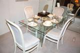 nice bevel glass top dinind room table with four chairs
comfortable and looks nice