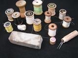 vintage spools of thread and Willcox and Gibbs needles