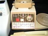 Vintage Oster Kitchen Center, including meat grinder, ice crusher, blender, dough hook, mixing bowls, mixer head, and plastic storage jars, etc.