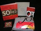 QT 50 years look back book, blanket and 2 disks of movies and QT commercials.