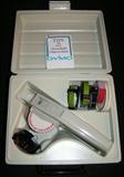Dymo labeling kit, mechanical with tape.