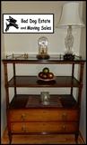 Wood shelf and drawers. Lamp, clock.