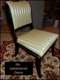 Six beautifully upholstered dining room chairs.