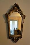 Pair of antique, hand carved gold mirrors