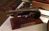 Derringer lighter on stand