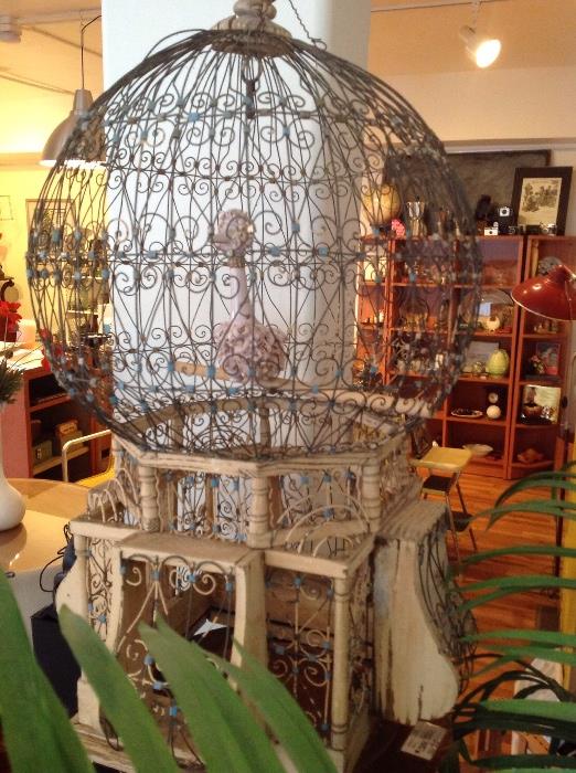 This is a very old and a wee bit fragile birdcage with a surprise tenant 