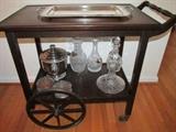 Vintage tea cart with metal casters and wheels