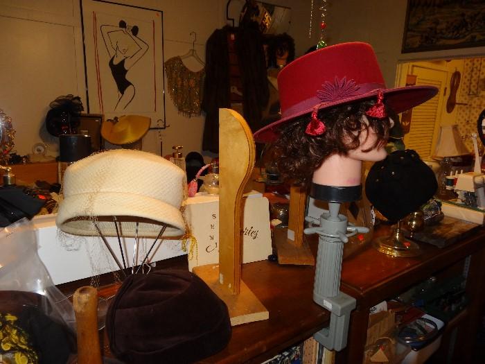 lots of antique hats and displays for sale