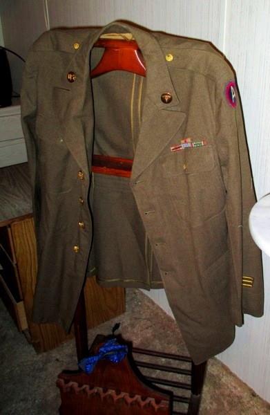 WW II US Army Dress jacket with Army Corpsman lapel ensignia and commendation bars. These guys tended the wounded often under fire. Wooden personal butler also for sale.